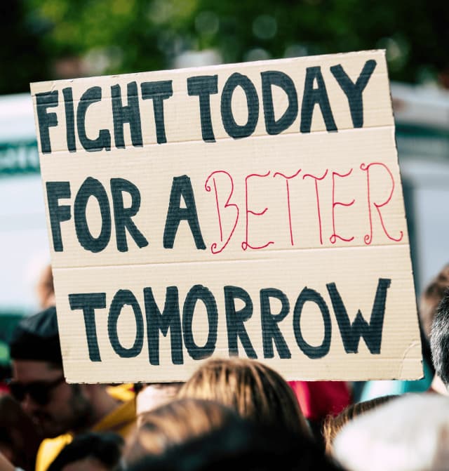 Protest sign reading fight today for a better tomorrow