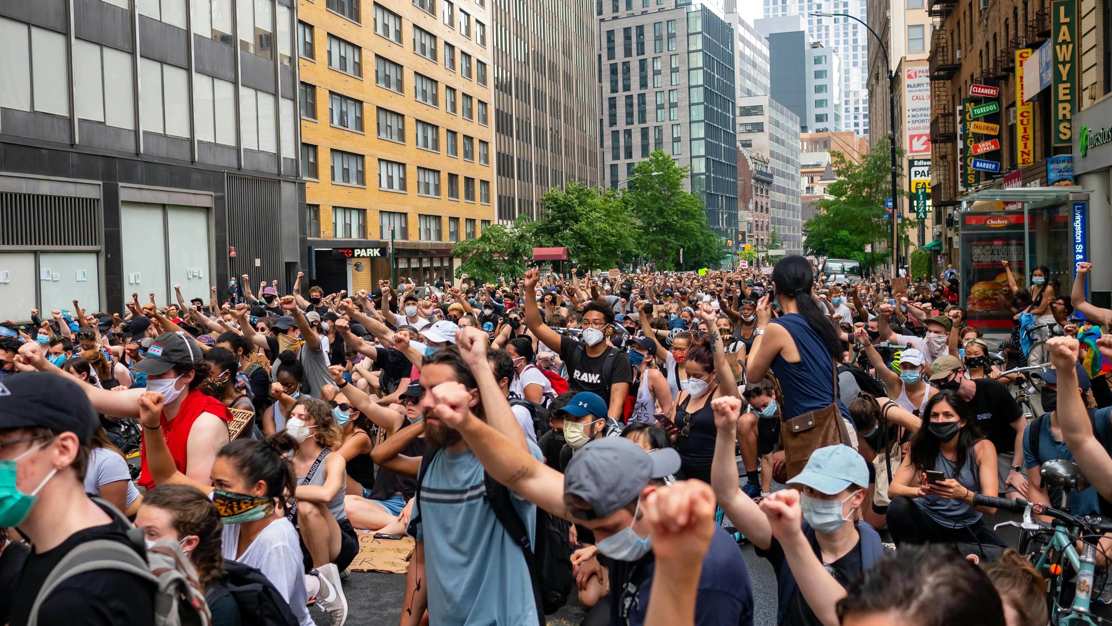 A group of protestors with fists in the air